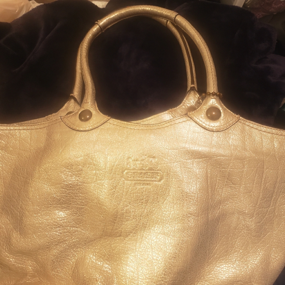 Coach gold tone